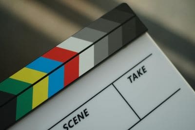 Close-up of a colorful film clapperboard used in movie production.