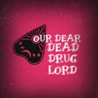 A dark butterfly with the text "Our Dear Dead Drug Lord" on a red background.
