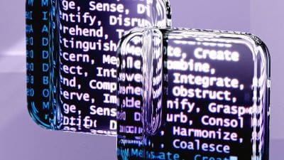 Glass bottles reflecting text on a purple background.