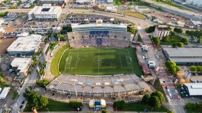 Aerial view of a large football stadium filled with spectators.