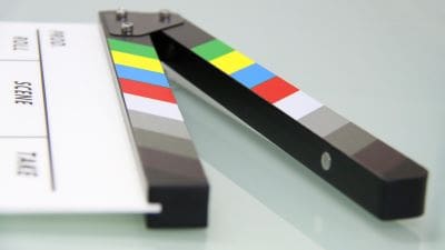 Two film clapperboards used in movie production.