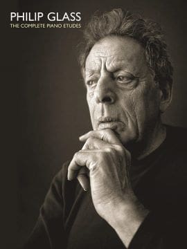 Pensive elderly man with hand on chin in thoughtful pose.