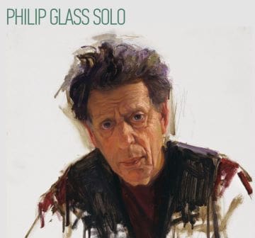 Philip Glass in a contemplative pose on his album cover.