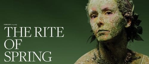 A person with cracked mud on their face against a green background.