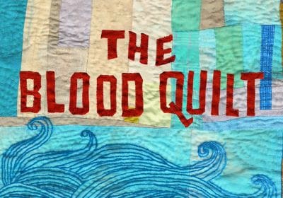 Title 'The Flood Quilt' on a colorful quilted fabric background.
