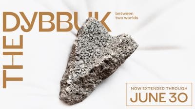 A rough, porous rock sample on a white background with text.