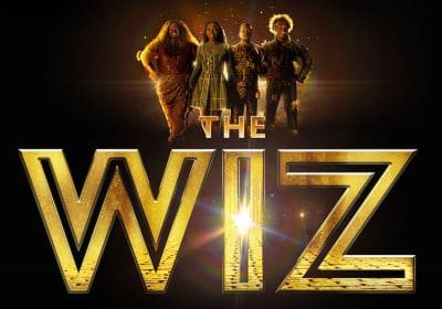 The Wiz movie poster featuring four main characters in front of a glowing title.