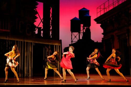 Amanda Castro (center) as Anita with the Shark Girls. Rachel Josefina (Francisca), Jordyn Waldo (Teresita), Amanda Castro (Anita), Julia Harnett (Consuelo) and Erin Gonzales (Estella) in LA Opera's 2025 production of West Side Story. 