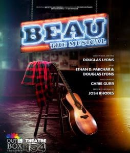 A guitar and jacket on a stool under a spotlight on stage at Beau the Magazine.