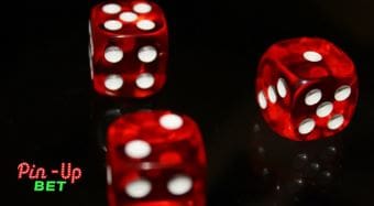 Three red dice showing different numbers on a black surface.