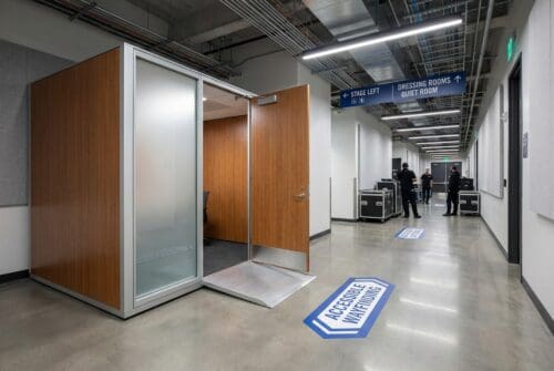accessible-hallway-with-quiet-room-and-dressing-room-signs_