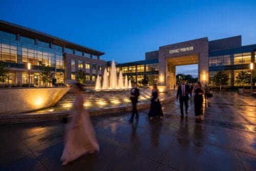 people-walking-by-illuminated-fountains-at-a-civic-venue._