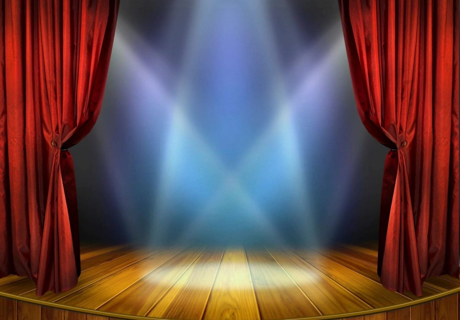 stage with red curtains pulled back and spotlights
