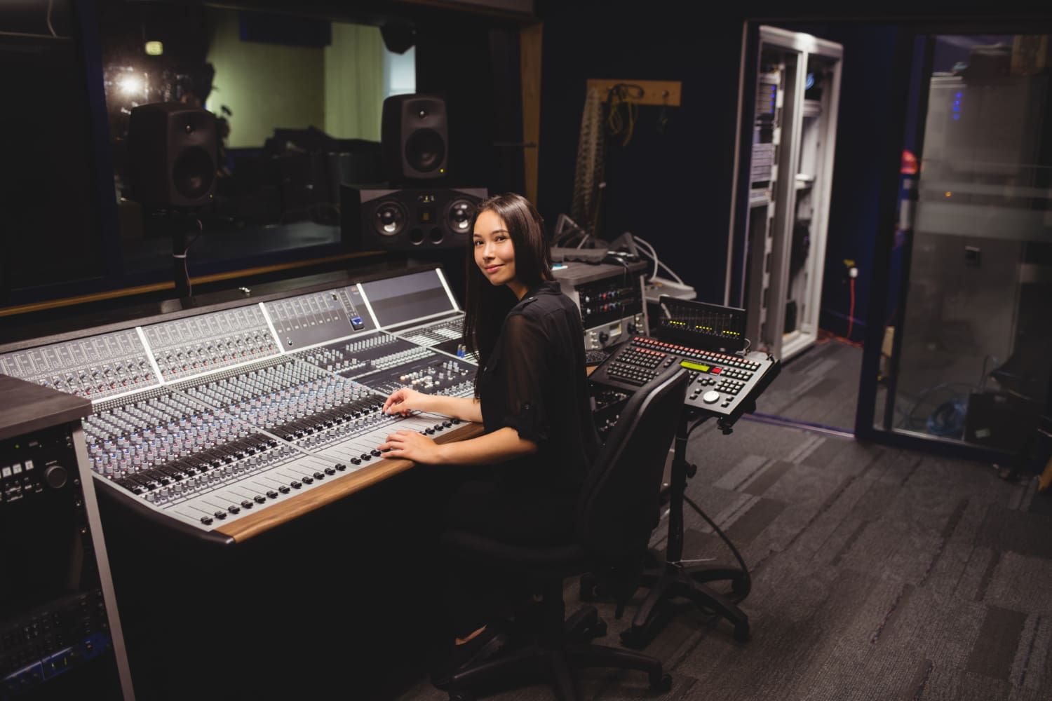 64835 Female student using sound mixer
